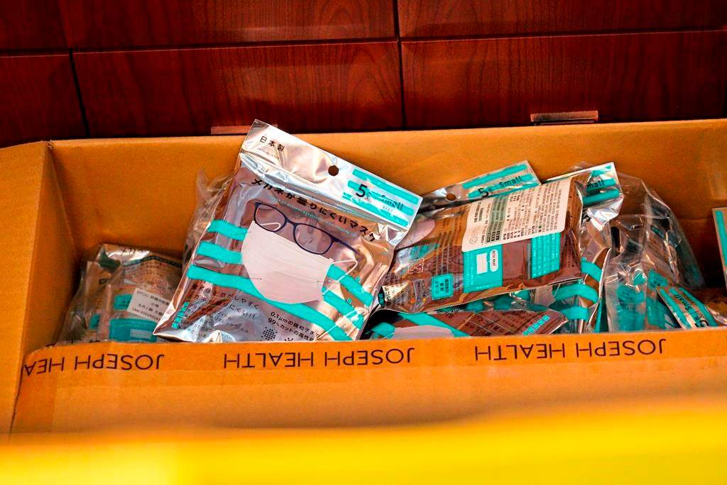 A box of masks imported from Japan sits inside a Yifeng Pharmacy in Wuhan, China, January 22, 2020.