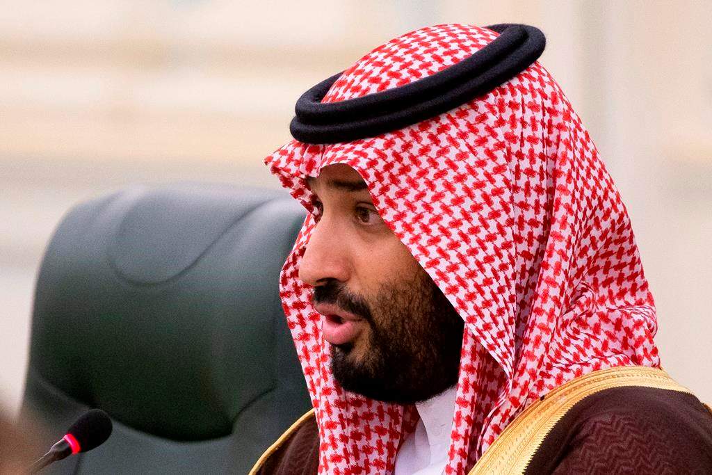 FILE - In this Oct. 14, 2019 file photo, Saudi Arabia's Crown Prince Mohammed bin Salman speaks to Russian President Vladimir Putin during the talks in Riyadh, Saudi Arabia.