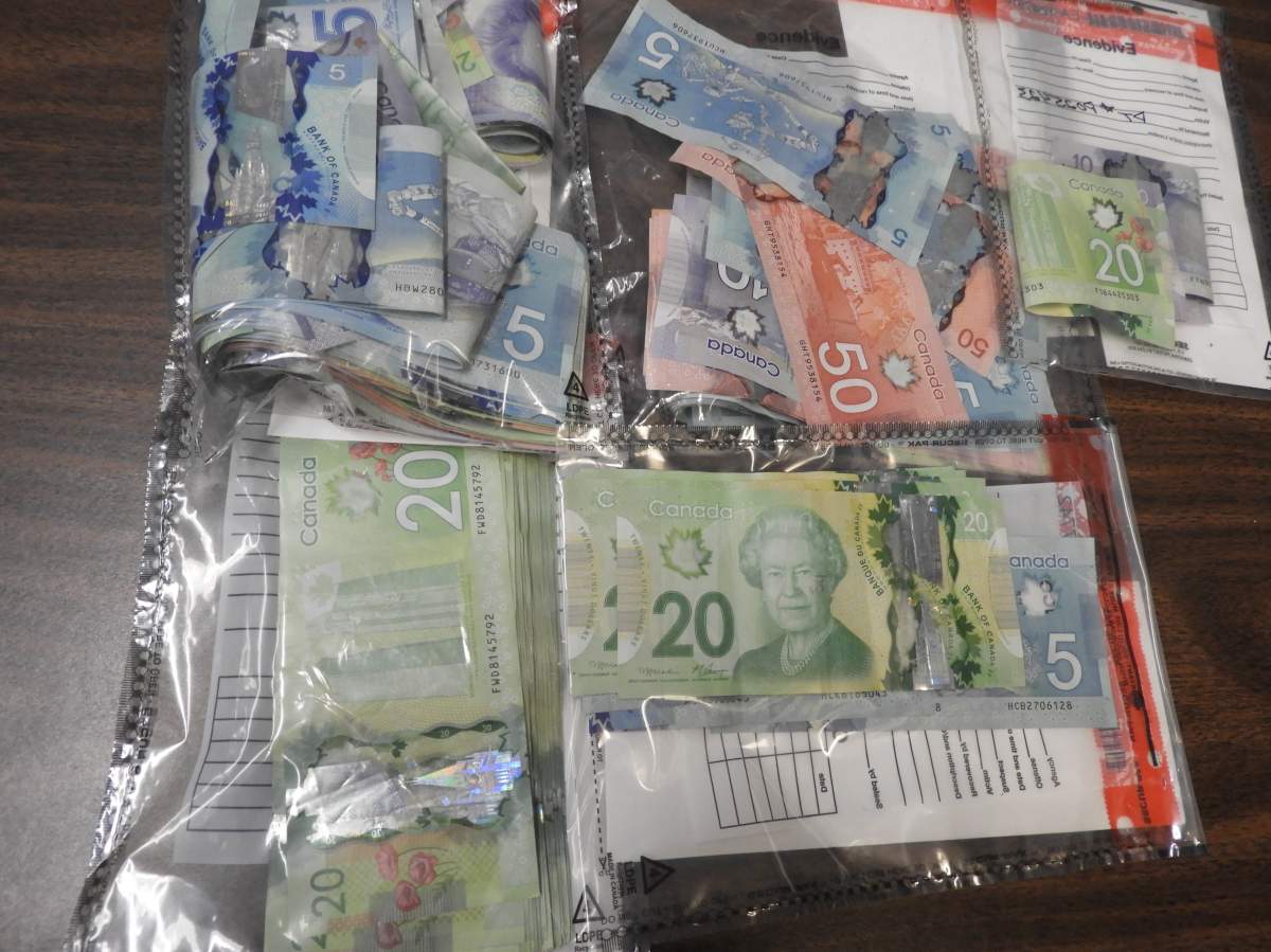 Cash seized following raids of two apartments on Hunter St. in Peterborough as part of a drug investigation.