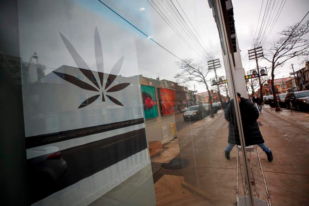 A customer walks into a Cannabis dispensary on Queen St. in Toronto, Monday, Jan. 6, 2020. THE CANADIAN PRESS/Cole Burston.