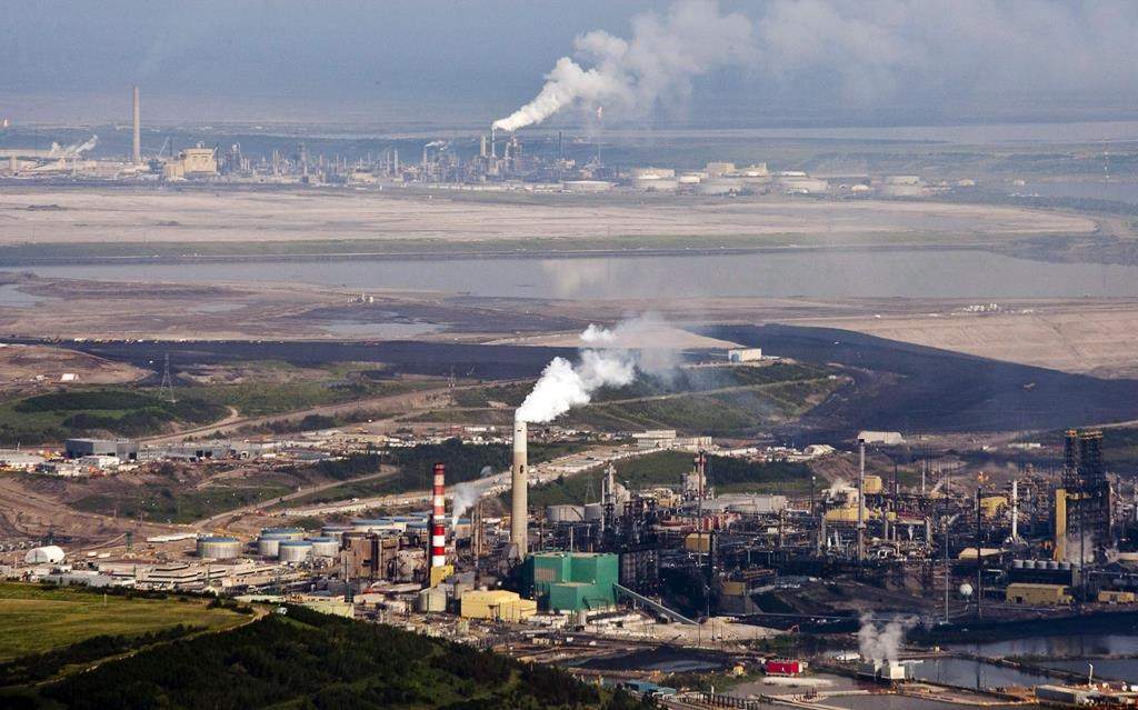 The Suncor oil sands facility seen from a helicopter near Fort McMurray, Alta., Tuesday, July 10, 2012. Spending in the oil and gas sector is expected to rise by six per cent this year after five years of declines. The Canadian Association of Petroleum Producers says it expects about $2 billion more will be invested in Canadian upstream energy this year than in 2019, taking to total to about $37 billion. THE CANADIAN PRESS/Jeff McIntosh.