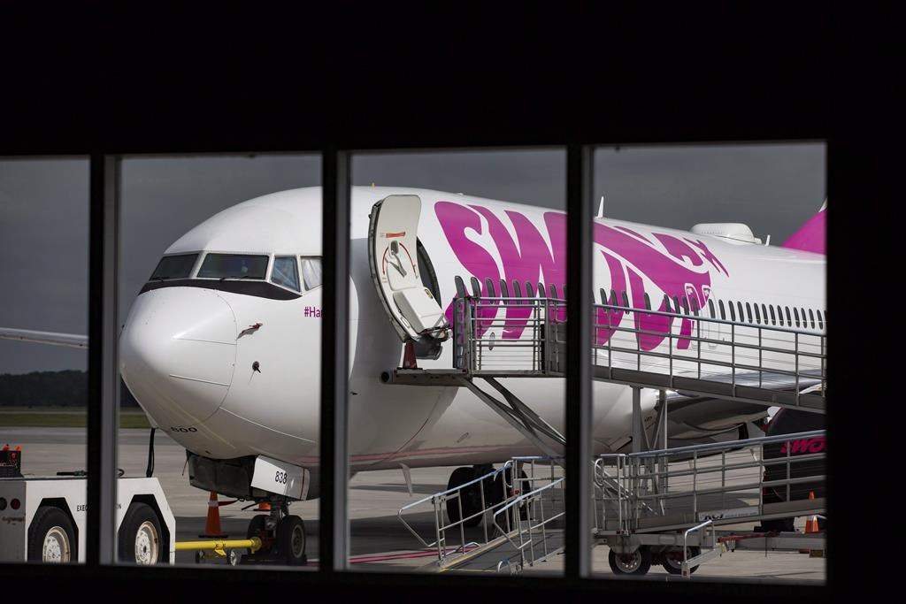 Swoop Airlines Boeing 737 on display during their media event, Tuesday, June 19, 2018 at John C. Munro International Airport in Hamilton, Ont.