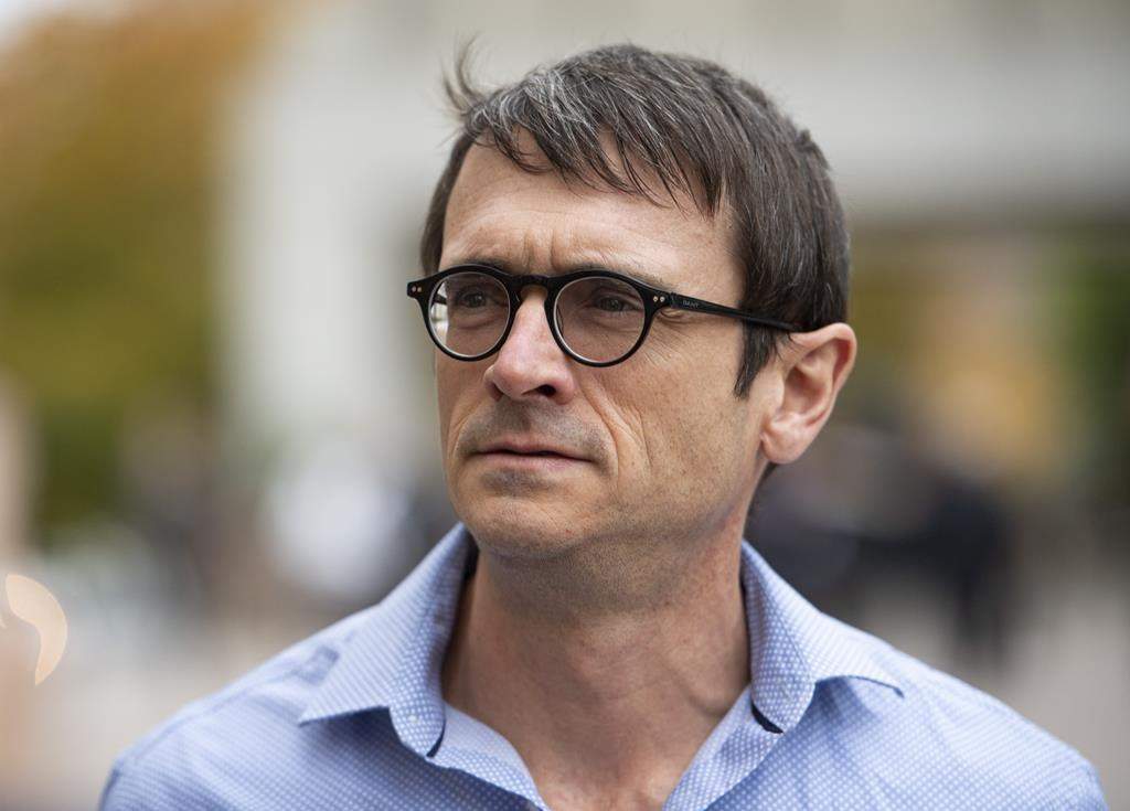 Cameron Ortis, a senior intelligence official at the RCMP, leaves the courthouse in Ottawa after being granted bail, Tuesday, Oct. 22, 2019. THE CANADIAN PRESS/Justin Tang.