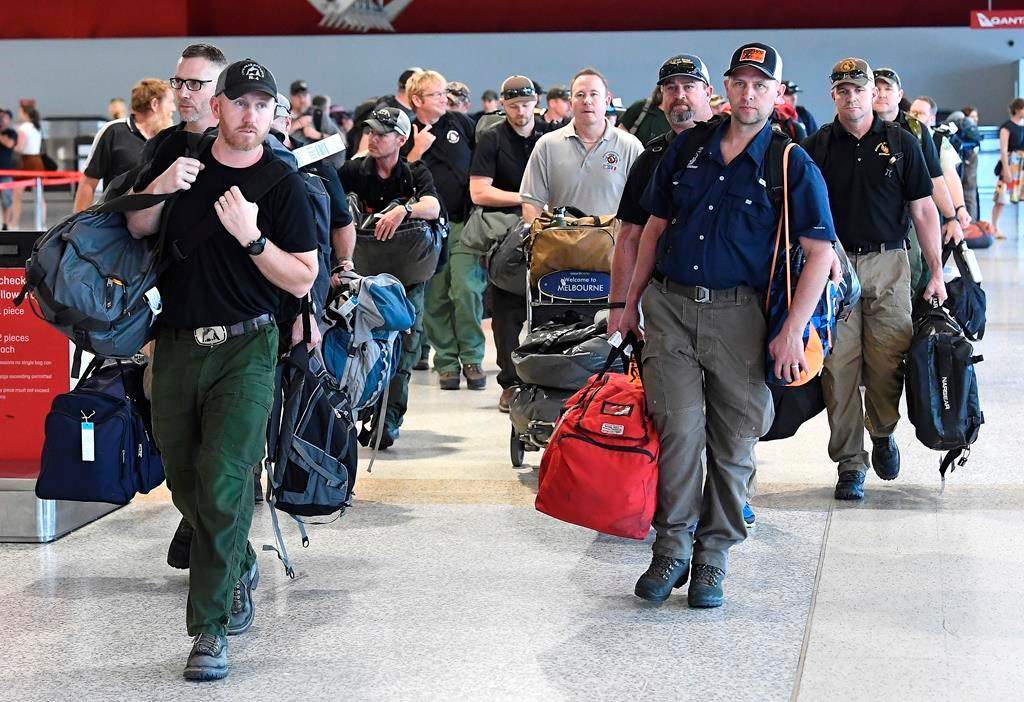 A contingent of 39 firefighters from the United States and Canada arrive at Melbourne Airport in Melbourne, Thursday, January 2, 2020. Another 69 Canadians are heading to Australia this week to help fight the country's worst bushfires in recent memory. Foreign Affairs Minister Francois-Philippe Champagne says on Twitter the deployment comes after Australia requested more help.