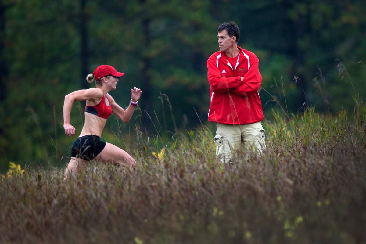 Coach Dave Scott-Thomas keeps an eye on the course as members of Guelph's Speed River track and field club workout Sept. 21, 2011.