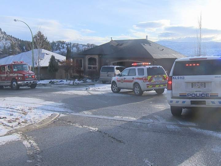 Emergency vehicles surround a West Kelowna home following a fire there on Thursday morning.