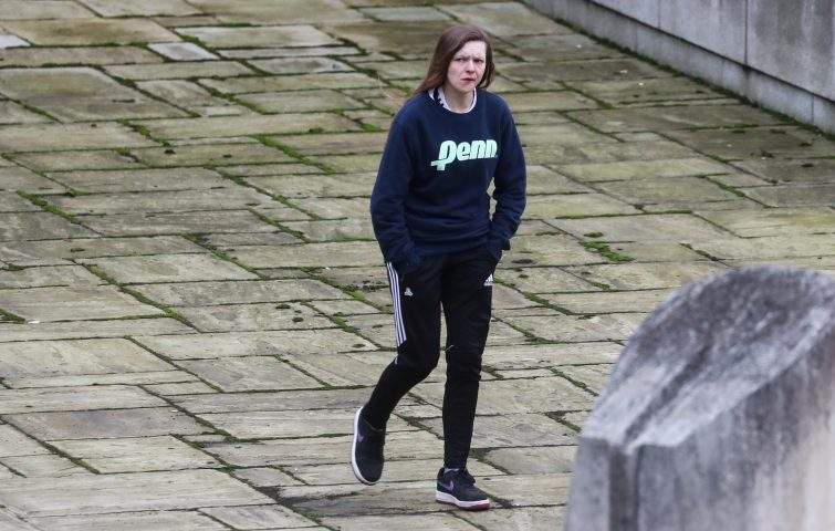Gemma Watts, a British woman who pleaded guilty for posing as a teenage boy to sexually groom young girls, walks to the Winchester Crown Court in Winchester, Britain, Jan. 10, 2020.