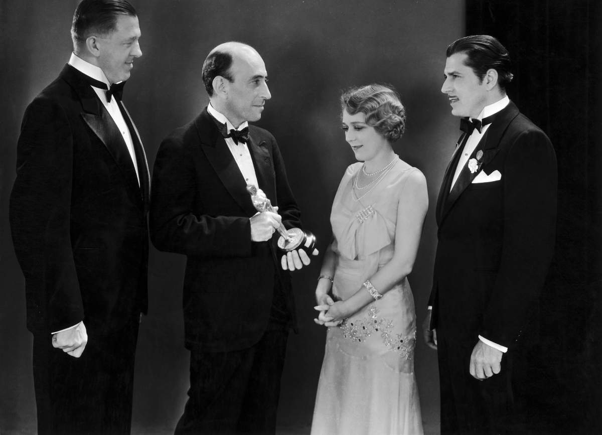 In 1929, William C. Demille, president of the Academy of Motion Picture Arts and Sciences (centre), hands the Oscar for Best Actress to Mary Pickford for her role in ‘My Best Girl’ and Best Actor to Warner Baxter for ‘Old Arizona’ (right). The author Hans Kraly (left) received the award for Best Screenplay for ‘The Patriot.’ (Photo by Keystone-France/Gamma-Keystone via Getty Images)
