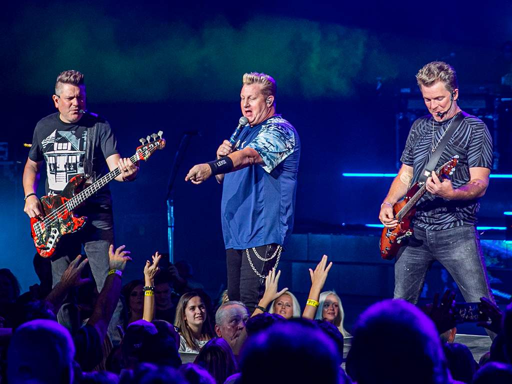 From left, Jay DeMarcus, Gary LeVox and Joe Don Rooney of the band Rascal Flatts perform in September 2019. 