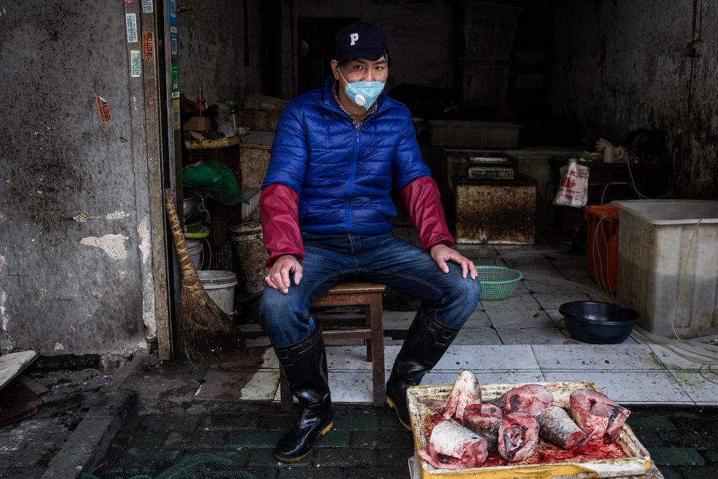 A vendor wears a protective mask in an alley on Jan. 31, 2020 in Wuhan, China.