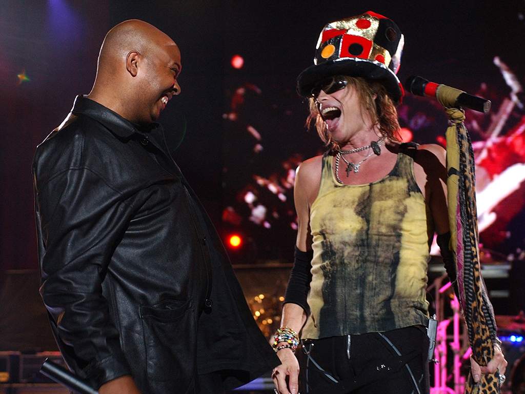 (L-R) Darryl "D.M.C." McDaniels of Run D.M.C. and Steven Tyler of Aerosmith performing live in concert.