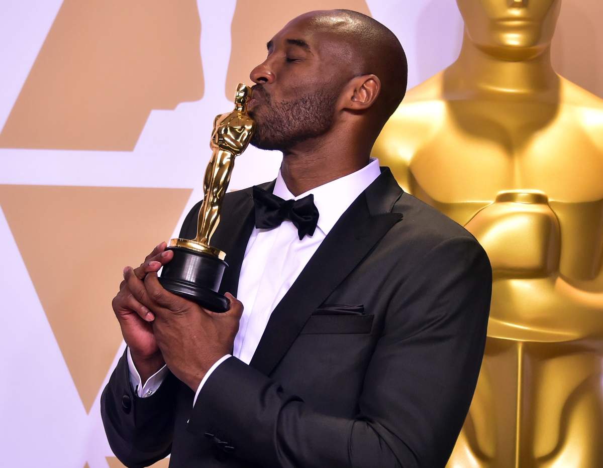 Kobe Bryant poses in the press room with the Oscar for Best Animated Short Film for 'Dear Basketball' during the 90th Annual Academy Awards on March 4, 2018, in Hollywood, Calif.