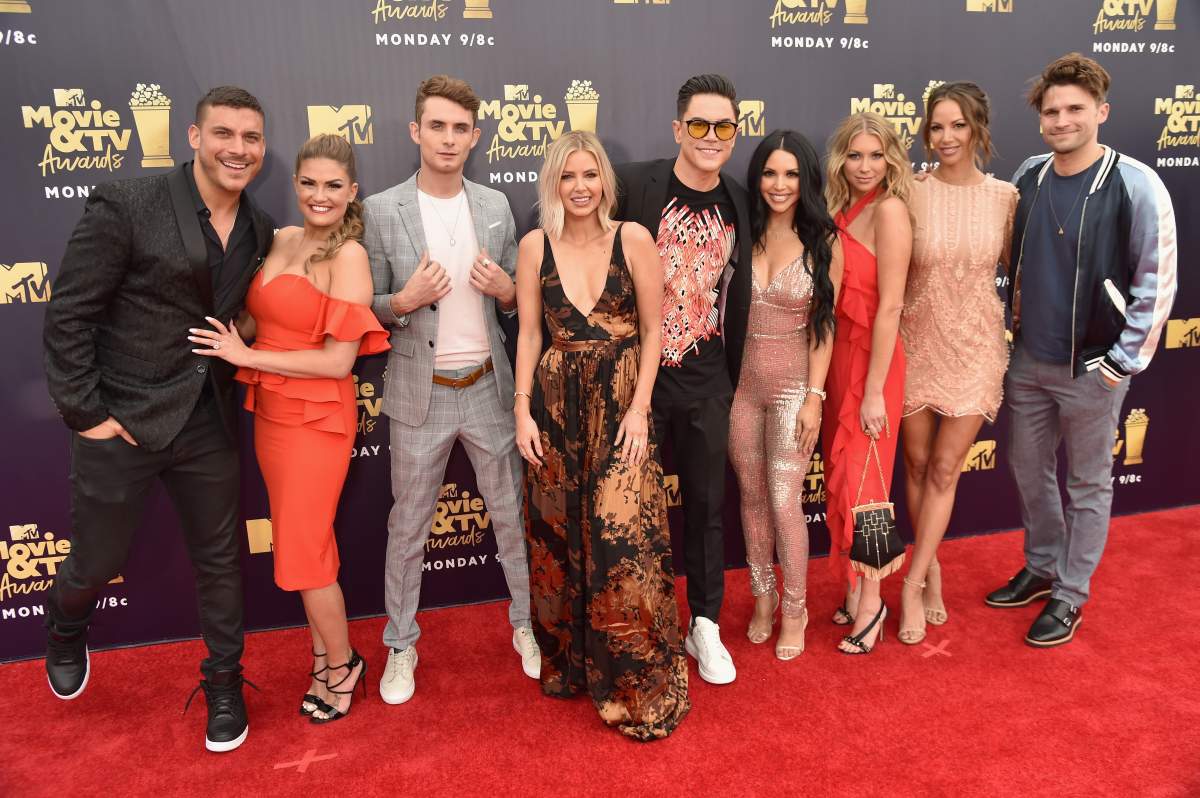 (L-R) Jax Taylor, Brittany Cartwright, James Kennedy, Ariana Madix, Tom Sandoval, Scheana Marie, Stassi Schroeder, Kristen Doute, and Tom Schwartz of Vanderpump Rules attend the 2018 MTV Movie And TV Awards at Barker Hangar on June 16, 2018 in Santa Monica, California.  