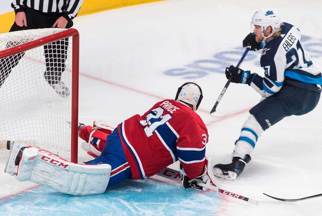 Winnipeg Jets’ Nikolaj Ehlers scores against Montreal Canadiens goaltender Carey Price during second period NHL hockey action against the Montreal Canadiens in Montreal on Jan. 6, 2020. THE CANADIAN PRESS/Graham Hughes
