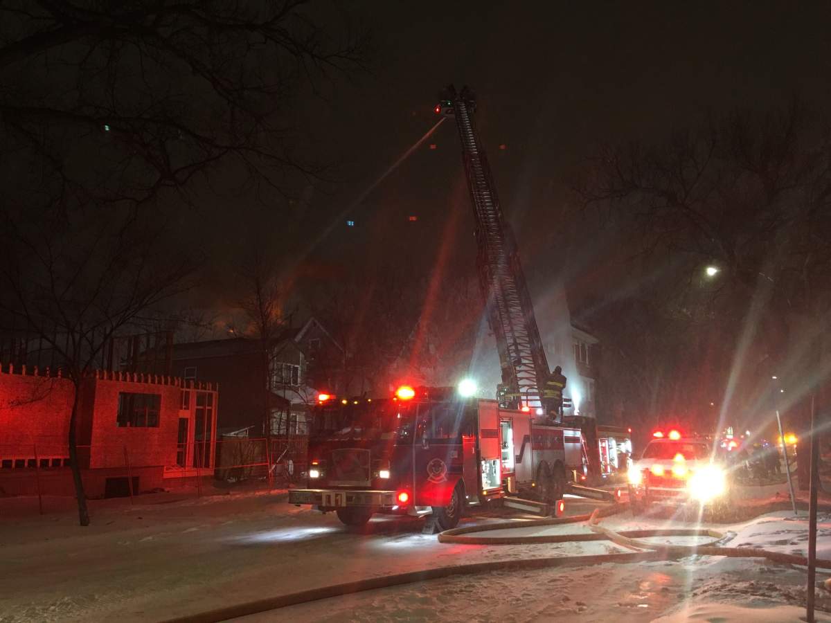Crews battle a fire at a vacant apartment block on Maryland Street.