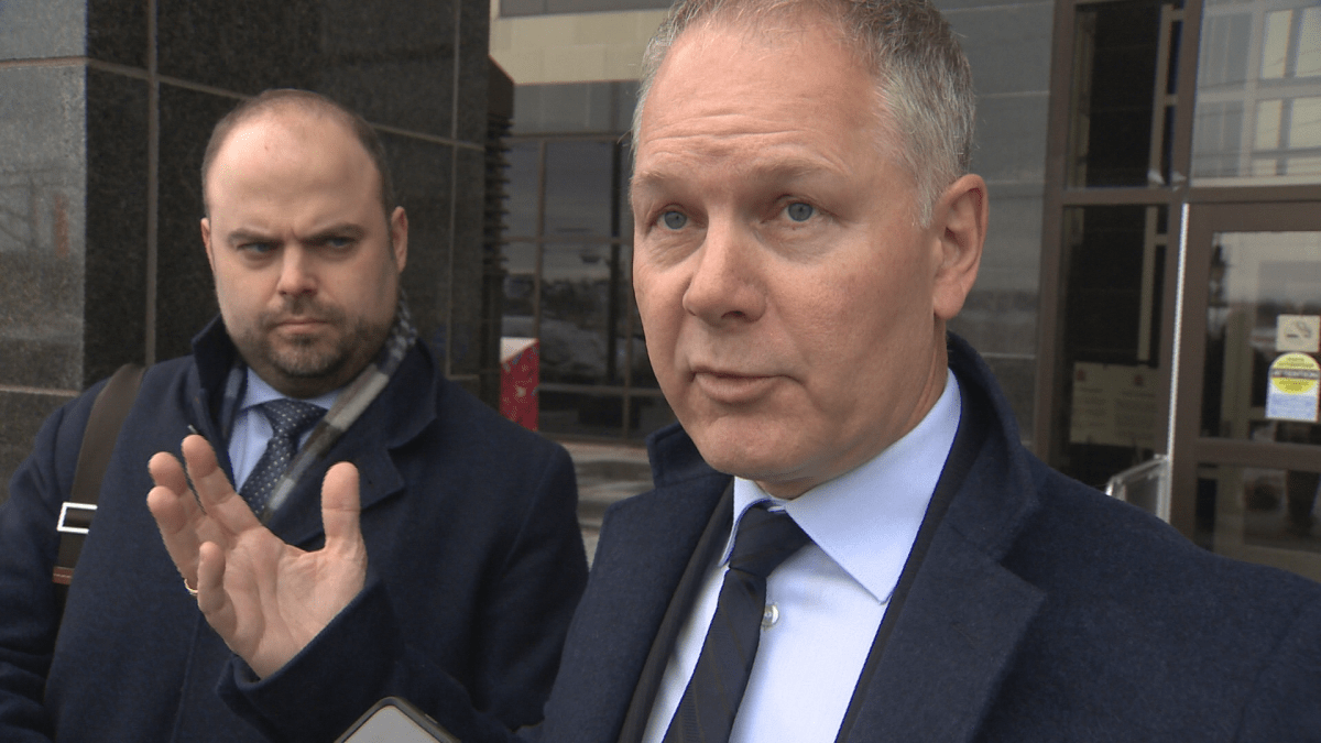 John McKiggan (right) and Mathieu Picard, lawyers for Jayde Scott in the proposed class-action lawsuit, speaking to reporters outside the Moncton courthouse Tuesday