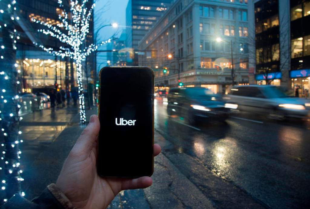 The Uber app is pictured on a smartphone in downtown Vancouver, B.C., Monday, Dec. 30, 2019.