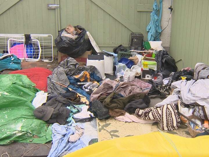 What was inside the make-shift lean-to in the backyard of Geraldine Mailloux’s property, after police peeled back the tarp on Thursday.