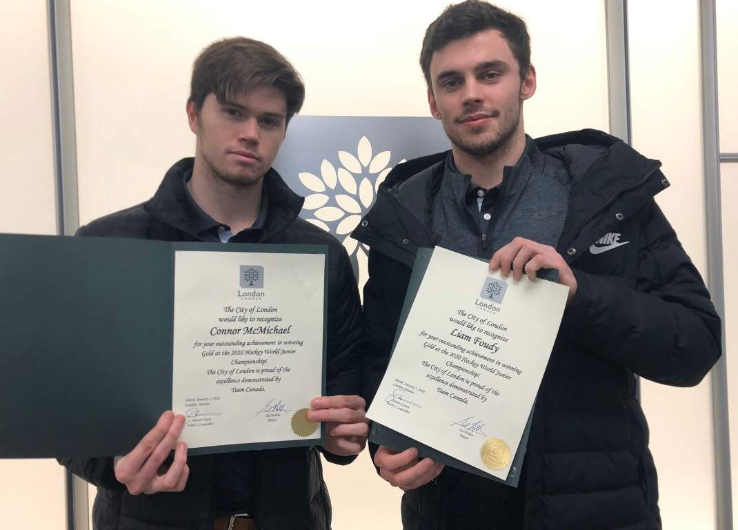 Knights’ forwards Connor McMichael and Liam Foudy show of their certificate from the city of London for their gold medal win at the world juniors.