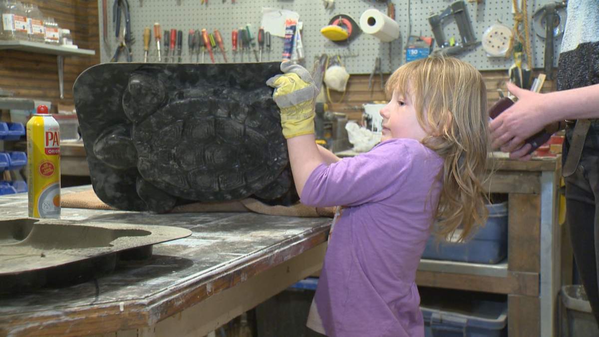 Mia Richards makes the cement turtles from a mold after mixing the cement herself in her grandmother’s garage.