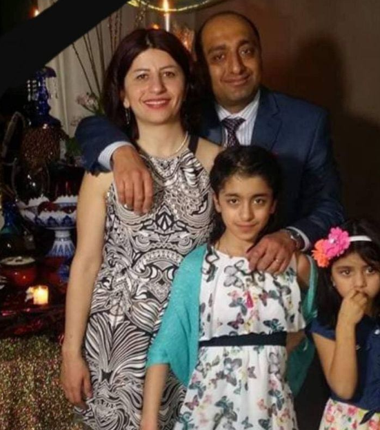 Mojgan Daneshmand (L) and Pedram Mousavi (R), both who were professors at the University of Alberta, with their daughters Darya and Darina Mousavi.