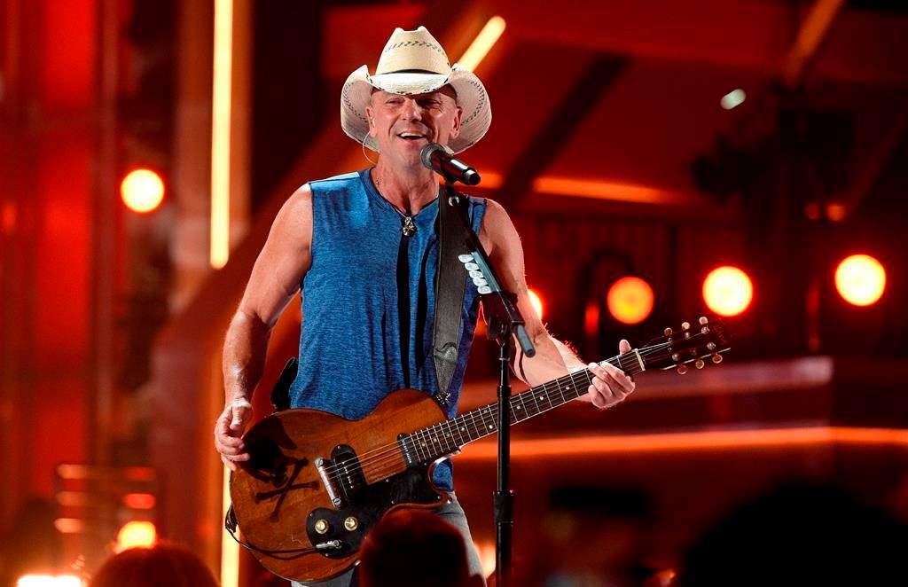 In this April 15, 2018, file photo, Kenny Chesney performs “Get Along” at the 53rd annual Academy of Country Music Awards at the MGM Grand Garden Arena on Sunday, in Las Vegas, Nev.