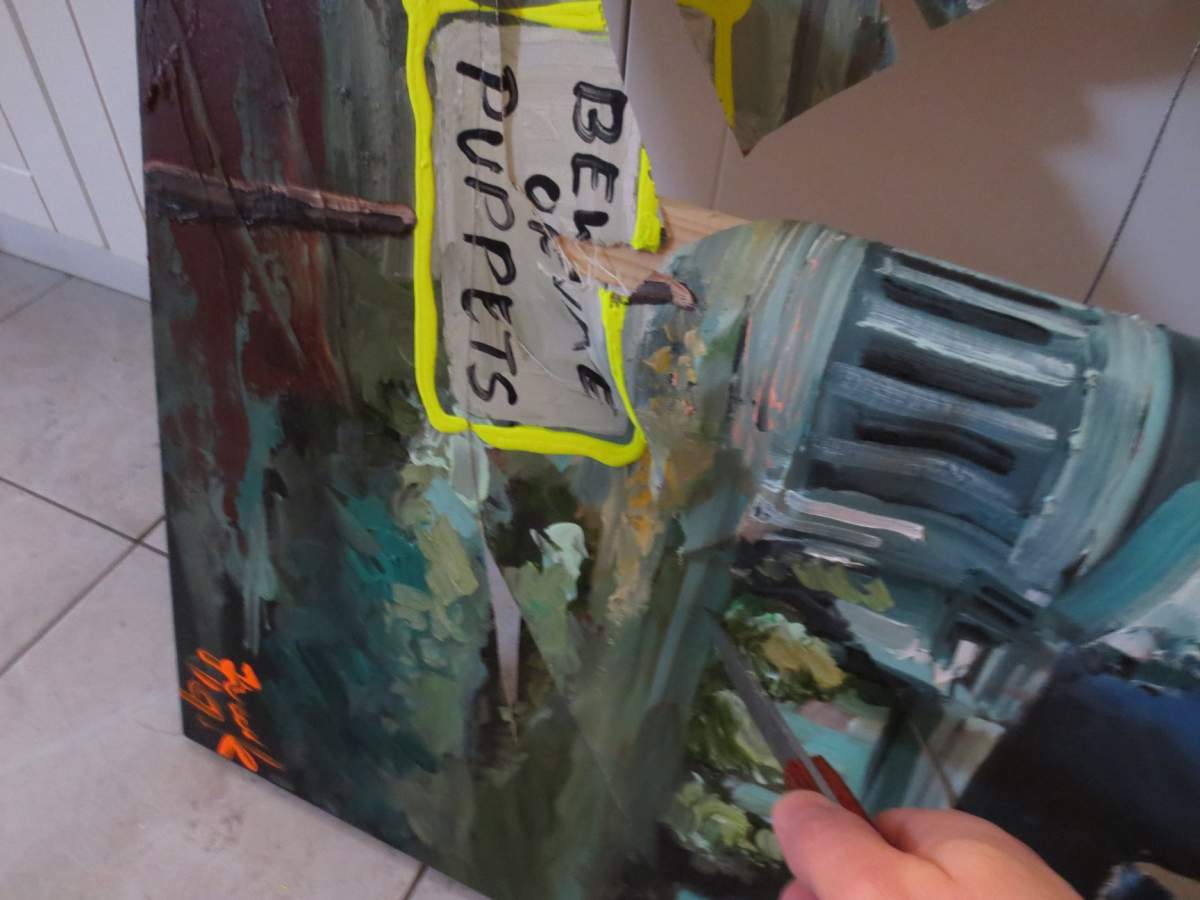 Artist Franklin Fernando says he received an email on New Year's Eve with photos of his painting destroyed by a knife.