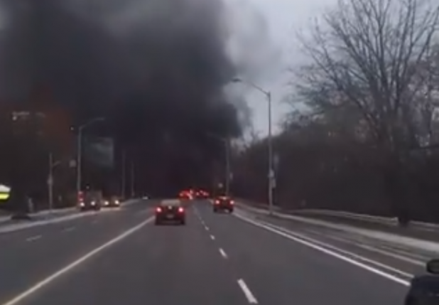 Smoke could be seen after a homeless encampment caught fire in Rosedale Valley. 