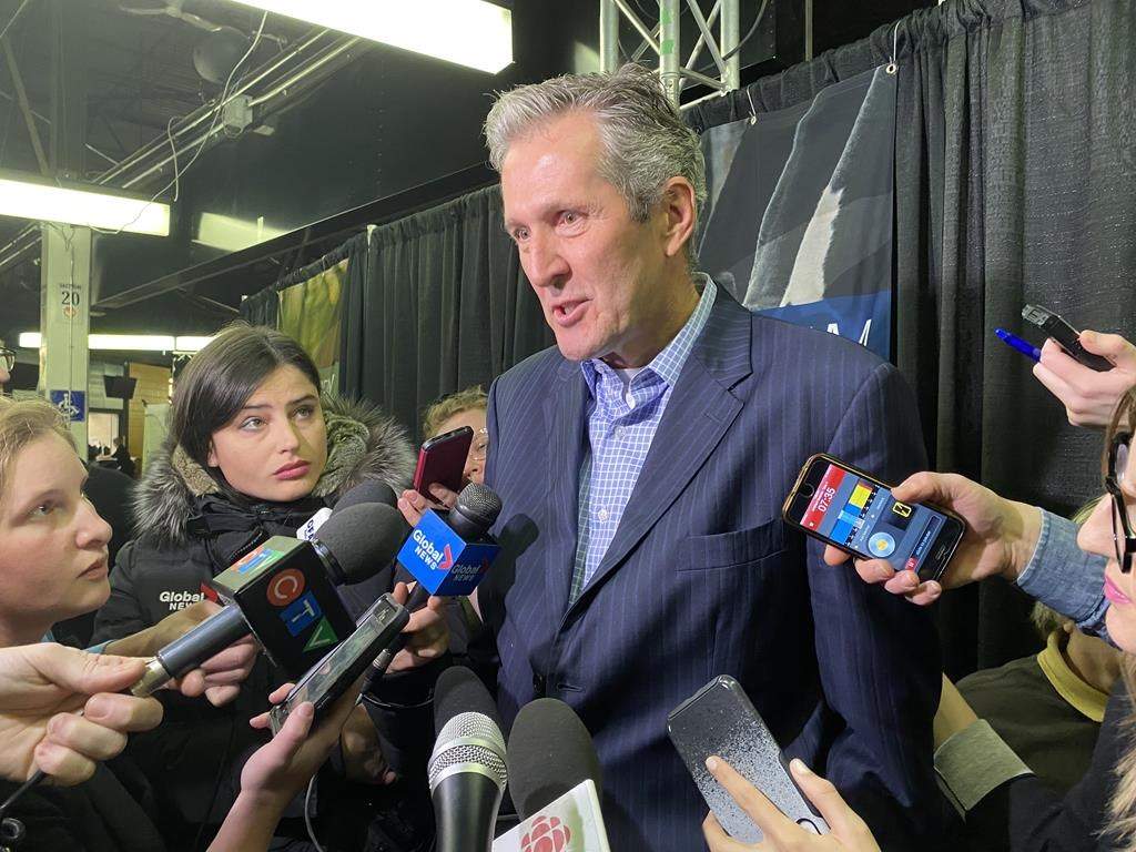 Manitoba Premier Brian Pallister talks to reporters in Brandon.