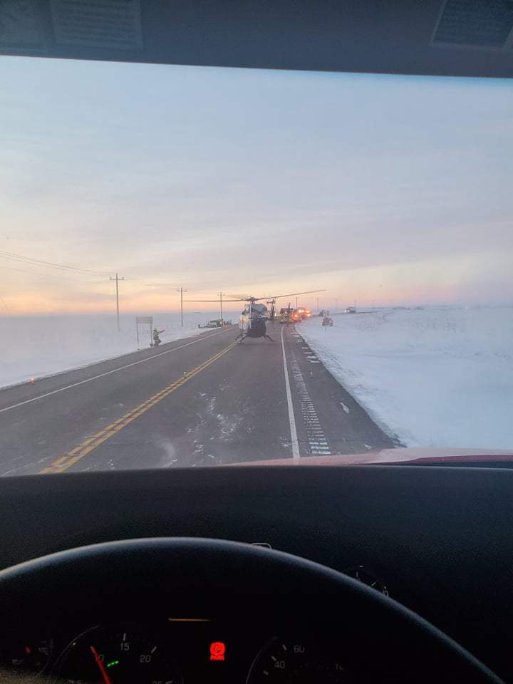 Emergency officials on the scene of a fatal highway crash near Taber, Alta., on Monday, Jan. 10.