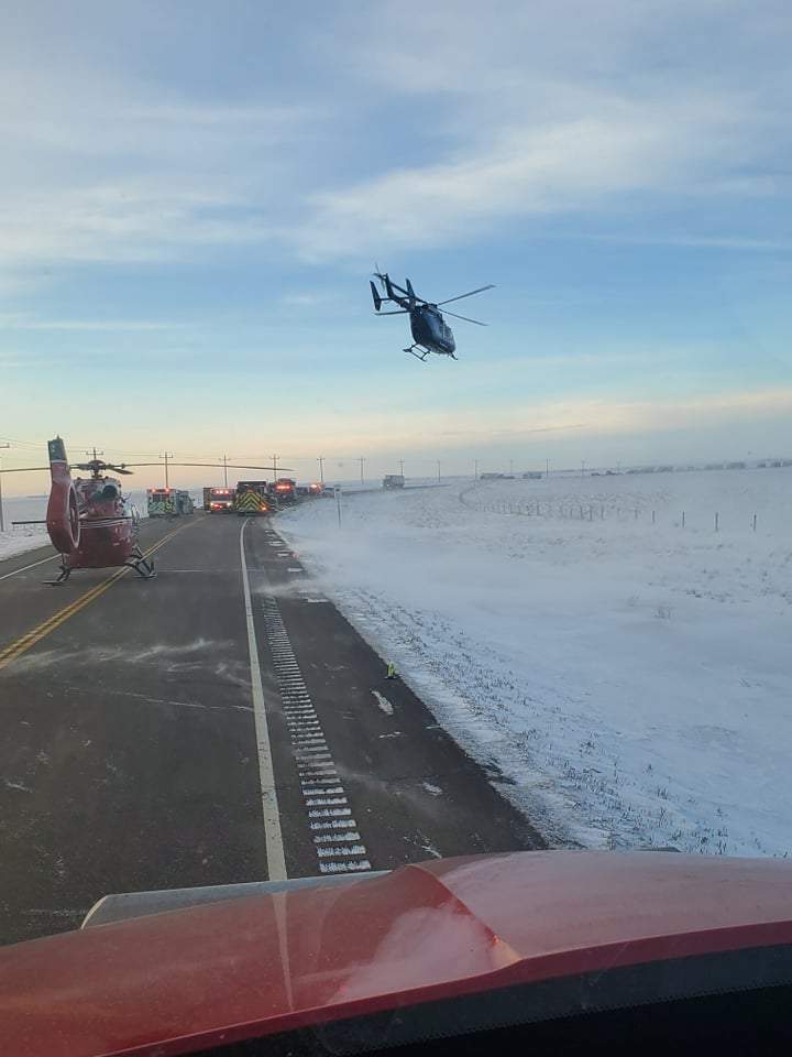 Emergency officials on the scene of a fatal highway crash near Taber, Alta., on Monday, Jan. 10.