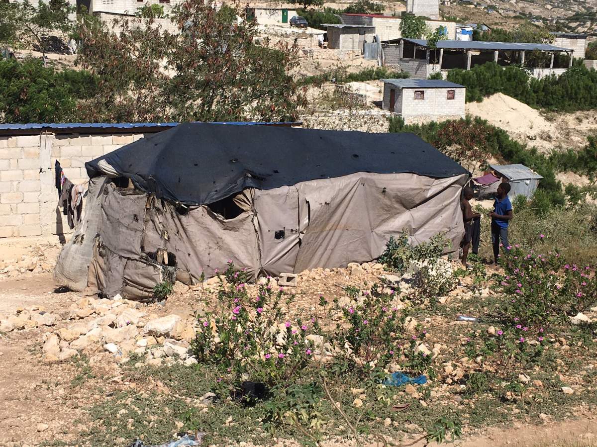 A family of seven lives inside this tent in Canaan, Haiti.