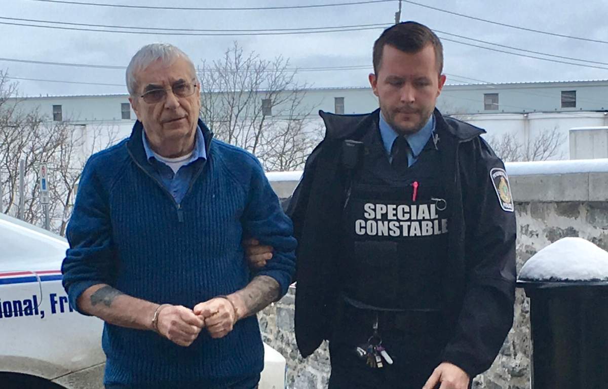Terrance Finn, left, is led to Superior Court in Peterborough on Monday, Jan. 6.