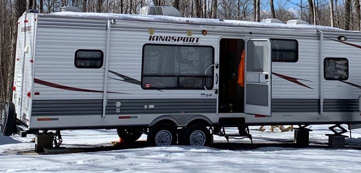 A camping trailer, an ATV and a utility trailer were reported stolen from a hunting camp in Peterborough County .