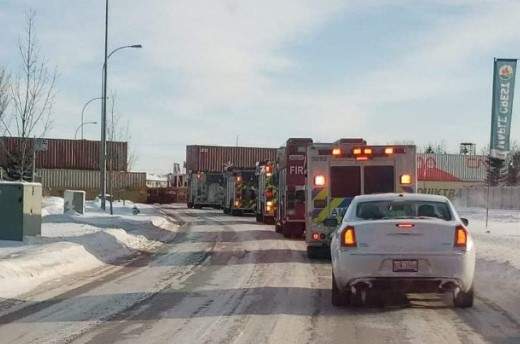 A shot of emergency vehicles being blocked from entering the Maple Crest community in southeast Edmonton.