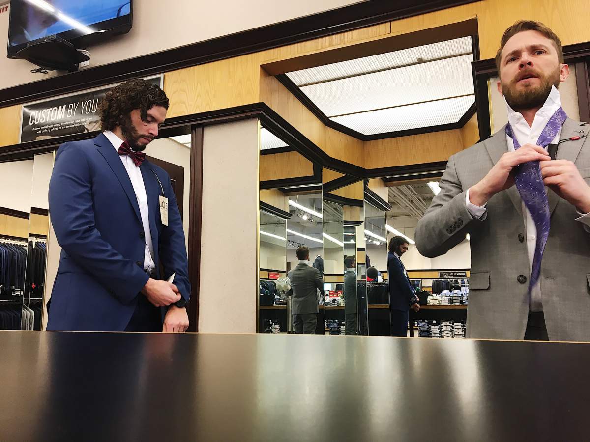 Adrian and Nick shopping for suits.