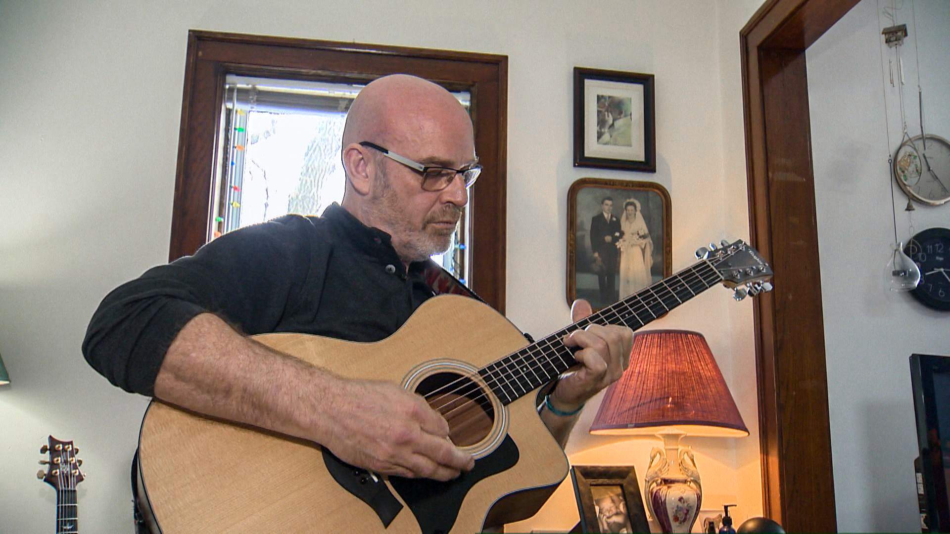 Via Rail's Fabien Bisson plays guitar