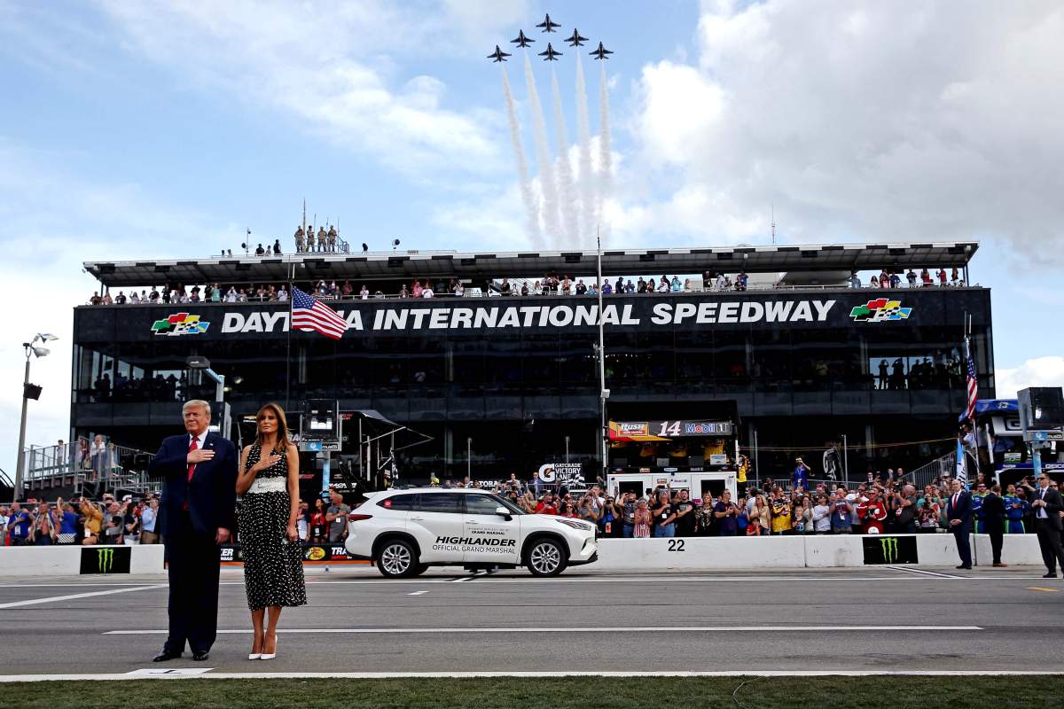 U.S. President Donald Trump with First Lady Melania Trump stand for the national anthem before the Daytona 500 at Daytona International Speedway.
