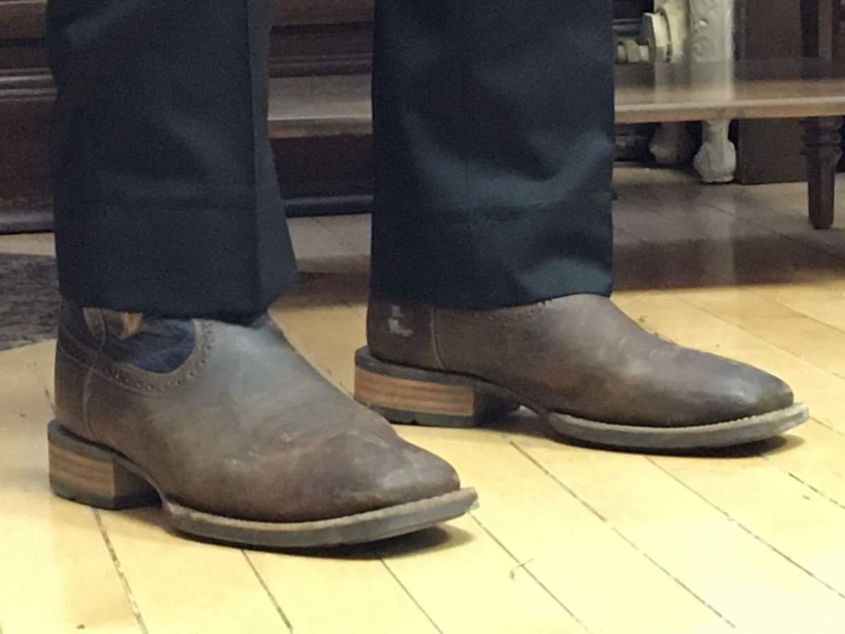 Alberta Finance Minister Travis Toews displayed his budget shoes Wednesday, Feb. 26, 2020.