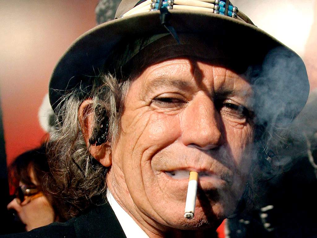 A file picture dated March 30, 2008 shows Rolling Stones guitarist Keith Richards smoking a cigarette at the Ziegfeld Theater in New York City. 