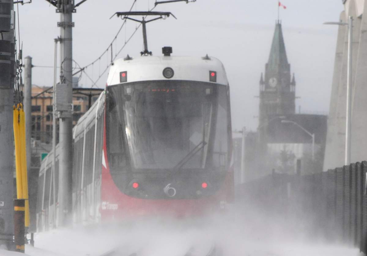 An OC Transpo light-rail train is seen heading towards downtown Ottawa on Tuesday, Jan. 21, 2020. An initial investigation finds jacking screws might be the cause of wheel cracks on the troubled transit line.