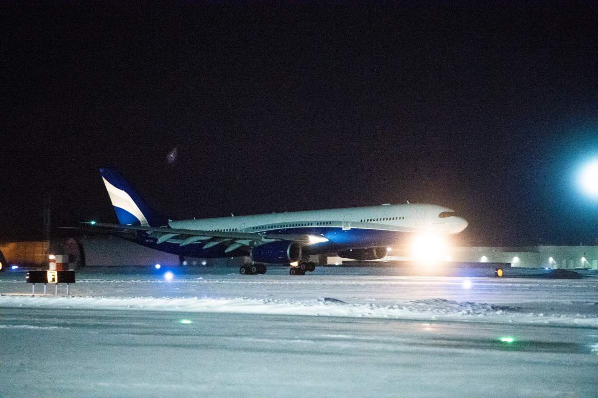 A plane carrying 174 Canadian citizens from the centre of the global novel coronavirus outbreak in Wuhan, China lands at CFB Trenton in Trenton, Ont., on Friday, Feb. 7, 2020.