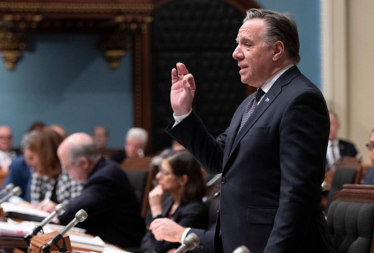 Quebec Premier Francois Legault, right, responds to the Opposition during question period, Friday, February 7, 2020 at the legislature in Quebec City. The government invokes closure to pass a legislation on education. 