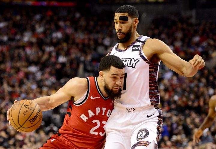 Toronto Raptors guard Fred VanVleet (23) runs into Brooklyn Nets guard Garrett Temple (17) as he drives to the net during second half NBA basketball action in Toronto, Saturday, Feb. 8, 2020.