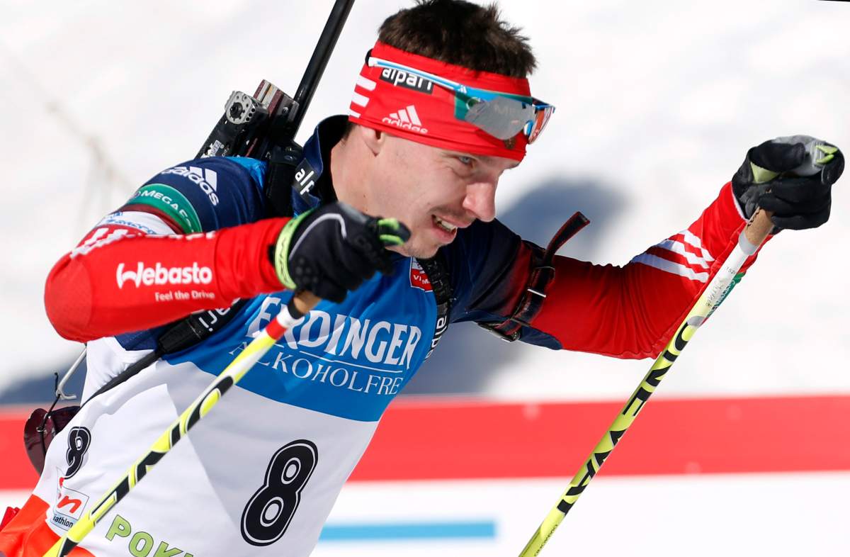 In this file photo dated Sunday, March 9, 2014, Russia's Evgeny Ustyugov competes in the men's 15km mass start at the biathlon World Cup competition in Pokljuka, Slovenia. The International Biathlon Union on Saturday Feb. 15, 2020, issued a two-year ban for Russia's Evgeny Ustyugov, who was part of the gold medal-winning mens relay team at the 2014 Sochi Winter Olympics. 