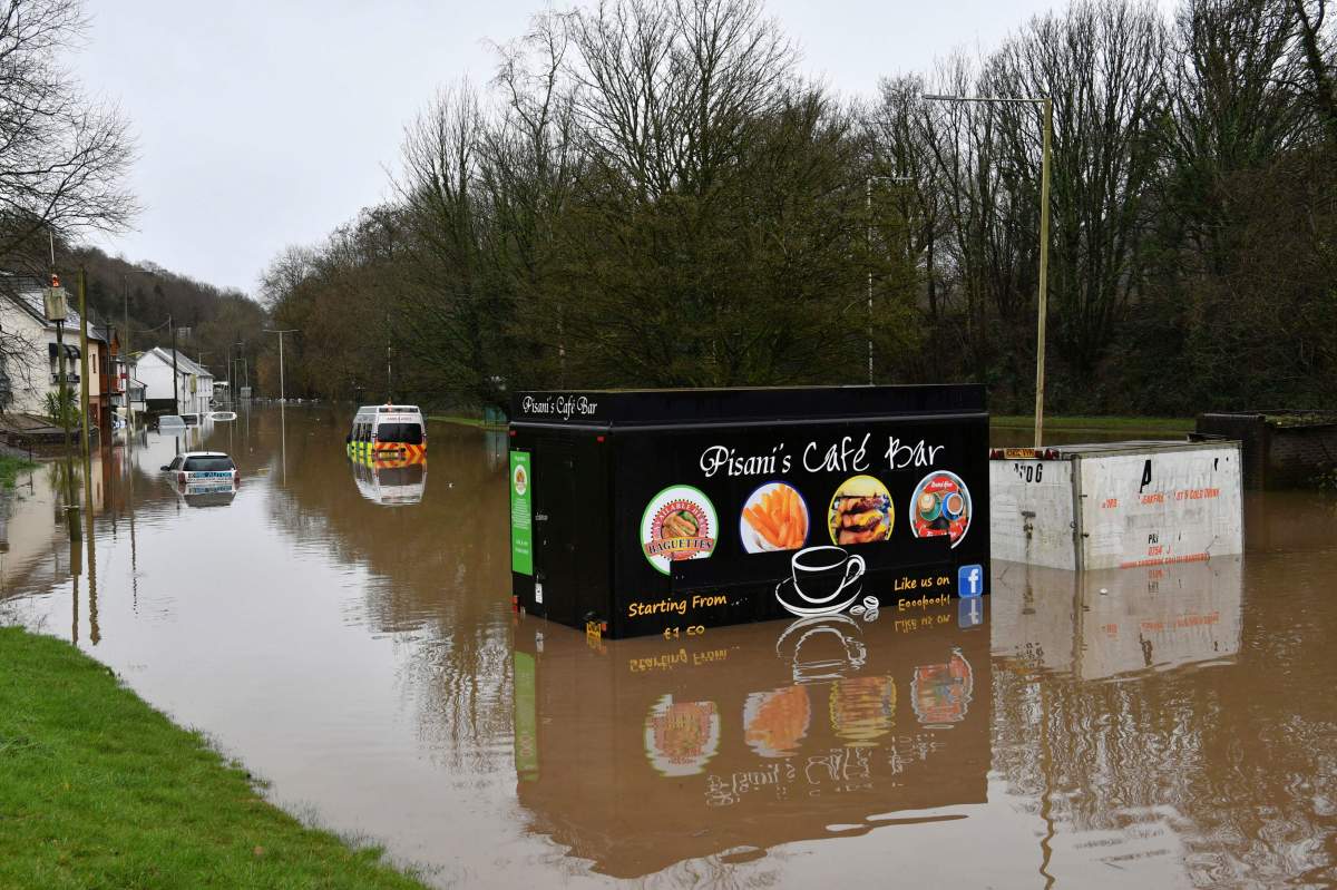 A half-submerged fast food van after flooding, in Nantgarw, Wales, Sunday, Feb. 16, 2020.