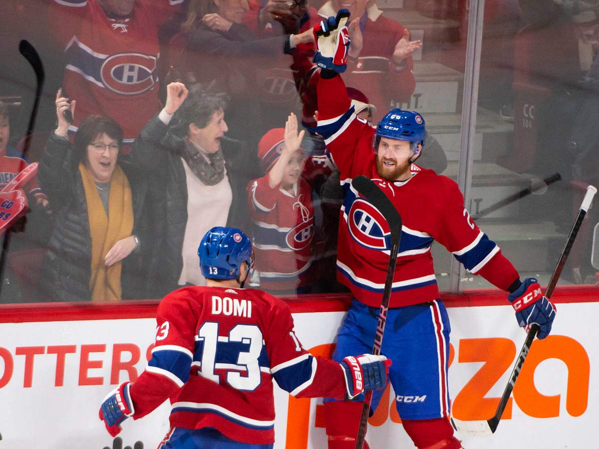 Montreal Canadiens defenceman Jeff Petry (26) celebrates his goal with teammate Montreal Canadiens centre Max Domi (13) during overtime NHL hockey action against the Carolina Hurricanes, in Montreal, Saturday, Feb. 29, 2020. 