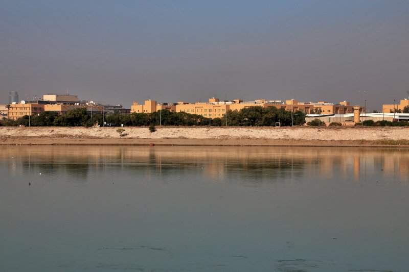 FILE - In this Friday, Jan. 3, 2020, file photo, U.S. Embassy is seen from across the Tigris River in Baghdad, Iraq. Iran has had its fingers in Iraq's politics for years, but the U.S. killing of an Iranian general and Iraqi militia commander outside Baghdad has added new impetus to the effort, stoking anti-Americanism that Tehran now hopes it can exploit to help realize the goal of getting U.S. troops out of the country. 