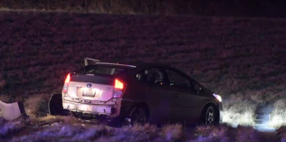 Hamilton police investigate the discovery of a vehicle in an Ancaster field on Wednesday, Feb. 12, 2020.