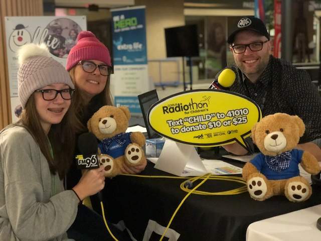 FM96 morning host Taz (right) is joined by a pair of folks who've been aided by the London Children's Hospital.